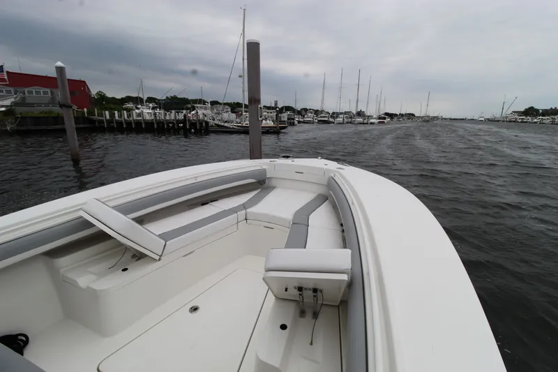Dojo Yacht Photos Pics 2020 Regulator 28 boat docked at marina with overcast sky.