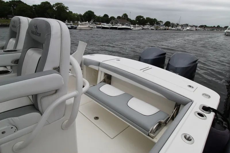 Dojo Yacht Photos Pics 2020 Regulator 28 boat with dual engines, featuring comfortable seating and sleek design.
