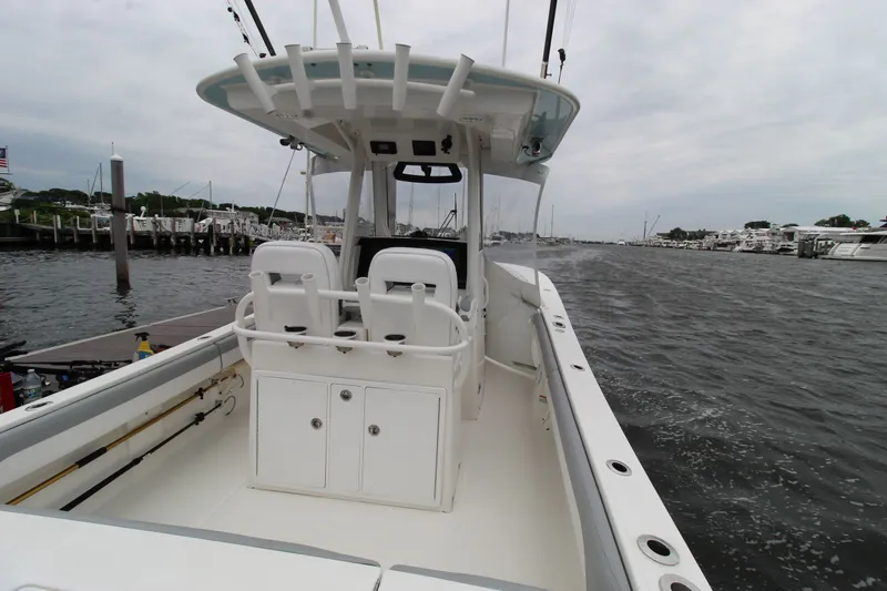 Dojo Yacht Photos Pics 2020 Regulator 28 boat with dual seats, docked in a marina.