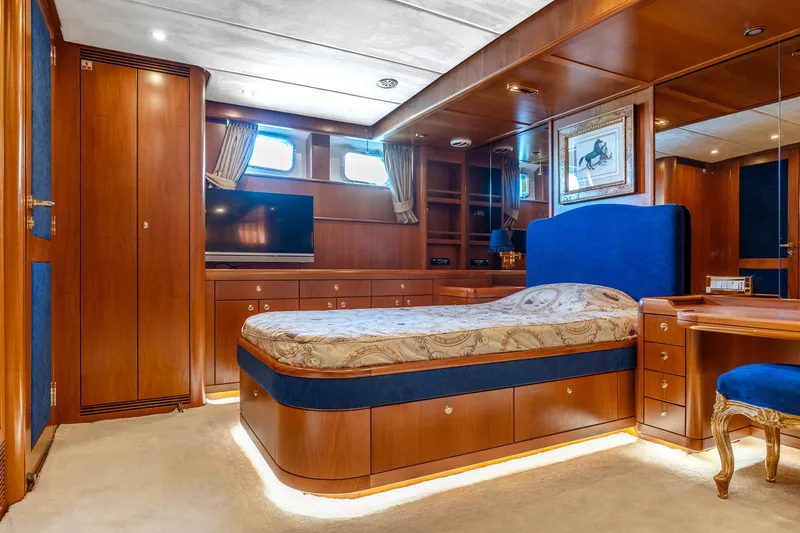 Yosma Yacht Photos Pics Luxurious 2013 Motor Yacht bedroom with elegant wood finish and modern amenities.