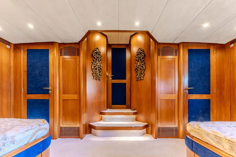 Yosma Yacht Photos Pics Luxurious 2013 Motor Yacht interior with elegant wood paneling and plush furnishings.