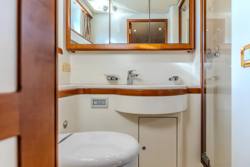Yosma Yacht Photos Pics Luxurious bathroom in a 2013 71' Motor Yacht, featuring modern fixtures and elegant wood accents.