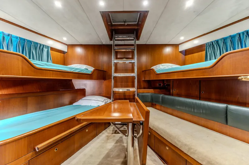 Yosma Yacht Photos Pics Luxurious 2013 Motor Yacht interior with wooden bunk beds and modern lighting.