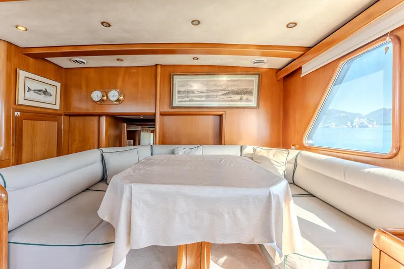 Yosma Yacht Photos Pics Luxurious 2013 Motor Yacht interior with elegant dining area and panoramic window views.