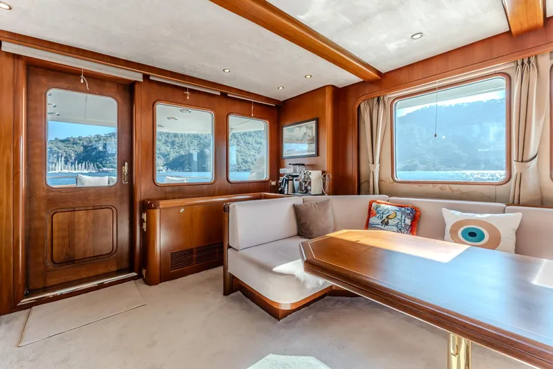Yosma Yacht Photos Pics Luxurious 2013 Motor Yacht interior with elegant wood finish and scenic window views.