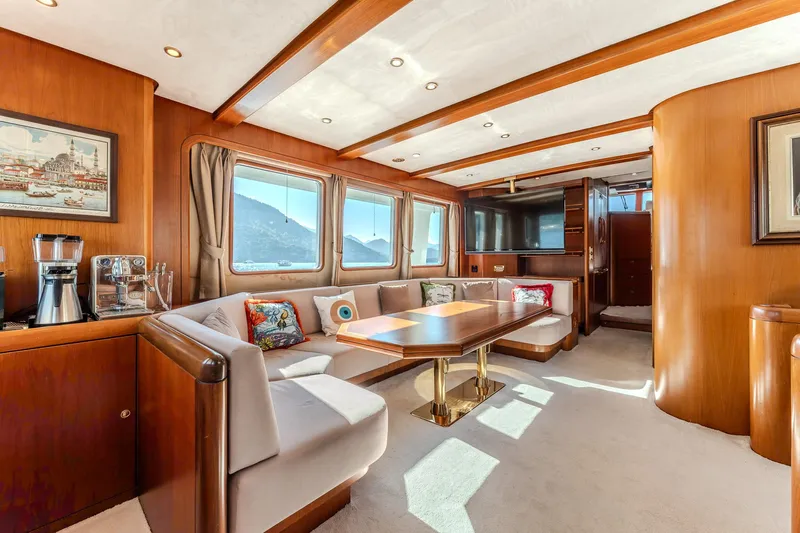 Yosma Yacht Photos Pics Luxurious 2013 Motor Yacht interior with elegant wood finishes and spacious seating area.