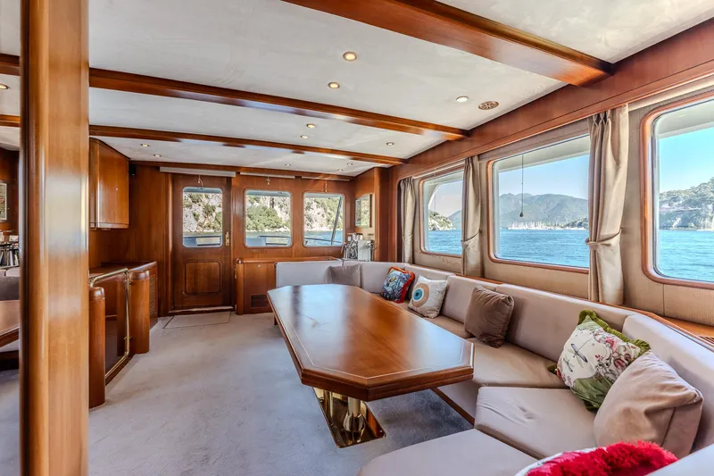 Yosma Yacht Photos Pics Luxurious 2013 Motor Yacht interior with elegant wood finishes and scenic ocean views.