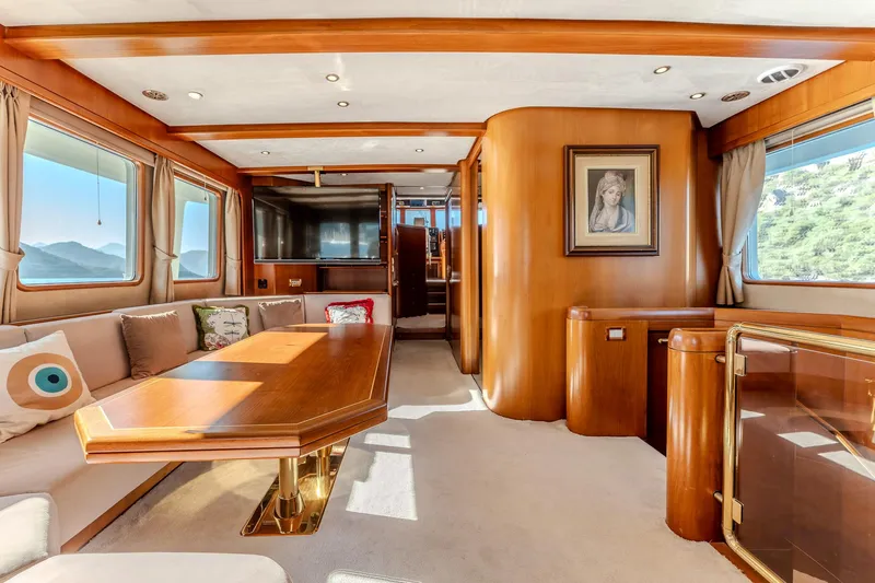 Yosma Yacht Photos Pics Luxurious 2013 Motor Yacht interior with elegant wood finishes and spacious seating area.