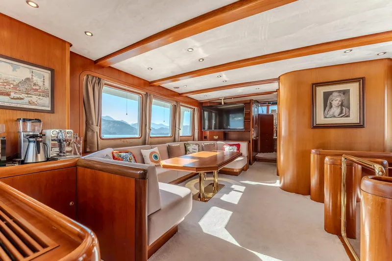 Yosma Yacht Photos Pics Luxurious 2013 Motor Yacht interior with elegant wood finishes and scenic window views.