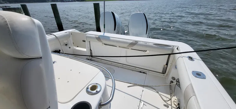  Yacht Photos Pics 2004 Boston Whaler 320 Outrage boat interior with seating and water view.