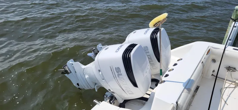  Yacht Photos Pics Twin Suzuki outboard engines on a 2004 Boston Whaler 320 Outrage boat.