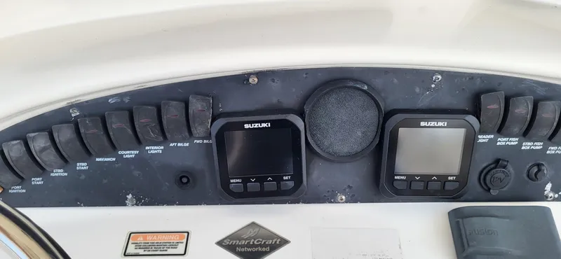  Yacht Photos Pics Control panel of a 2004 Boston Whaler 320 Outrage boat with Suzuki displays.