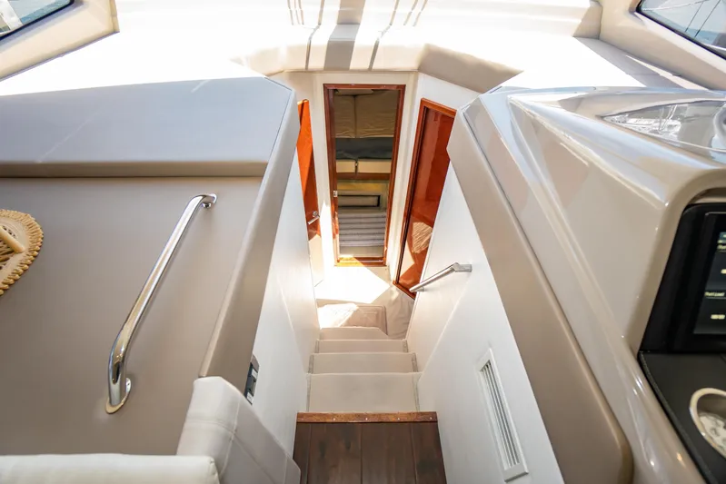  Yacht Photos Pics Interior view of 2017 Sea Ray Sundancer 460 yacht, showing stairs and cabin entrance.