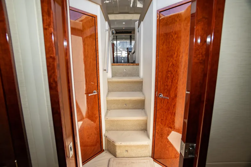  Yacht Photos Pics Interior of 2017 Sea Ray Sundancer 460 yacht with wooden doors and carpeted stairs.