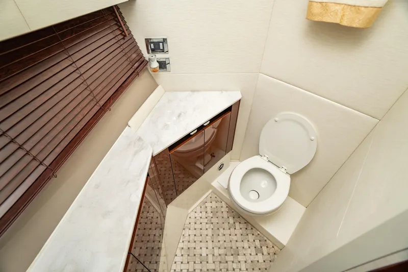  Yacht Photos Pics Luxurious bathroom in 2017 Sea Ray Sundancer 460 yacht with modern fixtures and elegant design.