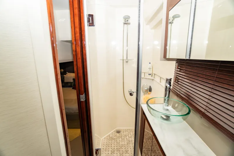  Yacht Photos Pics Luxurious bathroom in 2017 Sea Ray Sundancer 460 yacht with glass sink and shower.