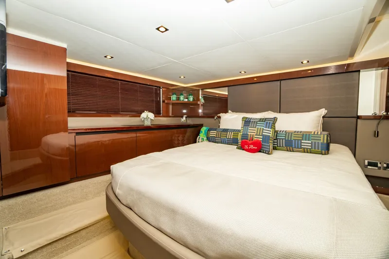  Yacht Photos Pics Luxurious bedroom interior of 2017 Sea Ray Sundancer 460 yacht with modern decor.