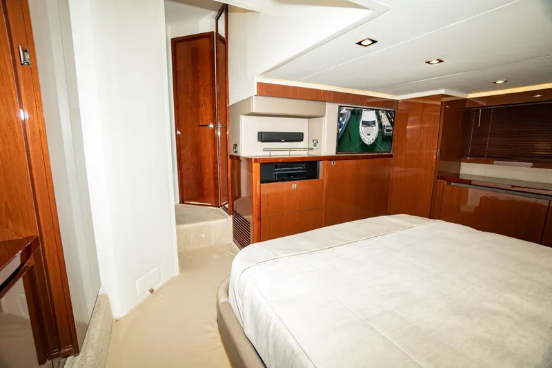  Yacht Photos Pics Luxurious interior of 2017 Sea Ray Sundancer 460 yacht with wood finishes and modern amenities.