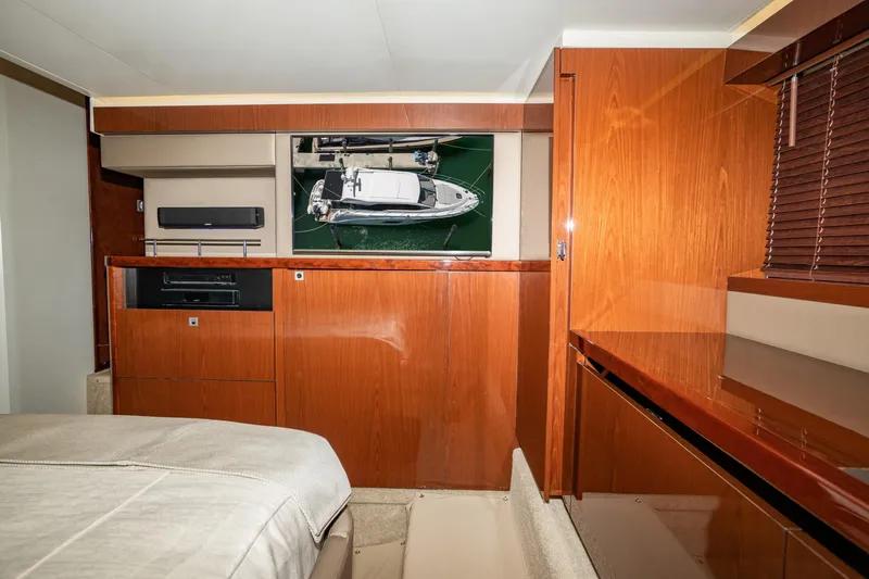  Yacht Photos Pics Luxurious interior of 2017 Sea Ray Sundancer 460 yacht with wood finishes and modern amenities.
