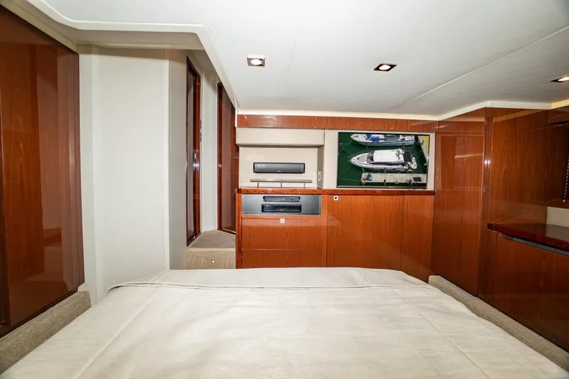  Yacht Photos Pics Luxurious interior of 2017 Sea Ray Sundancer 460 yacht with wood paneling and modern amenities.