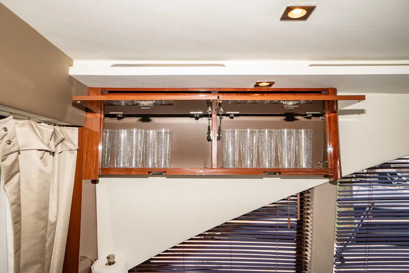  Yacht Photos Pics Cabinet with glassware inside a 2017 Sea Ray Sundancer 460 yacht interior.
