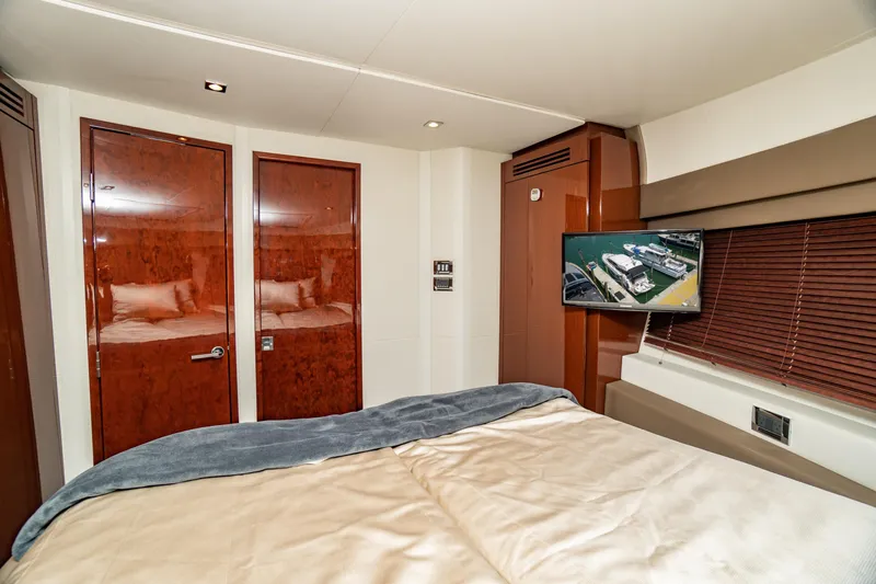  Yacht Photos Pics Luxurious 2017 Sea Ray Sundancer 460 yacht bedroom with TV and elegant wood finishes.