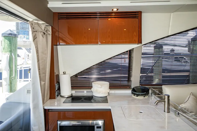  Yacht Photos Pics Luxurious kitchen interior of 2017 Sea Ray Sundancer 460 yacht with modern amenities.