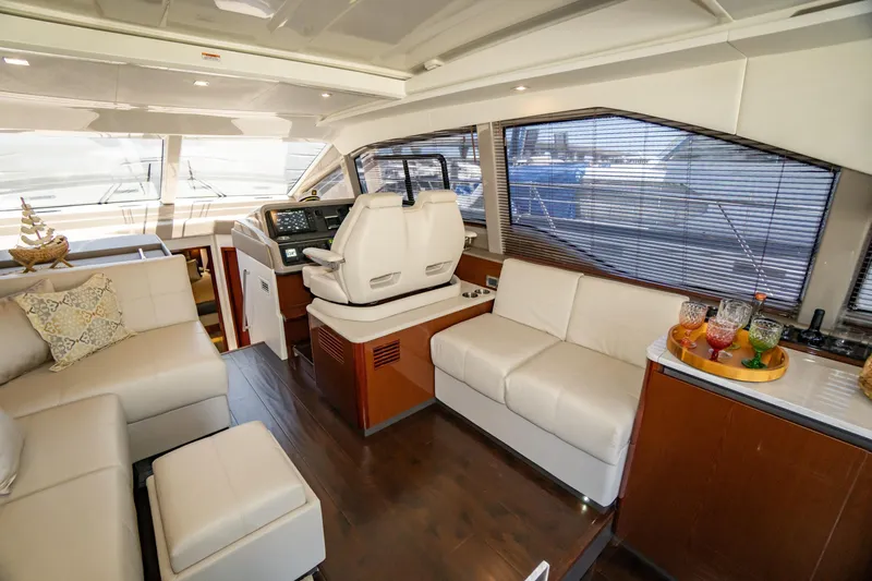  Yacht Photos Pics Luxurious interior of 2017 Sea Ray Sundancer 460 yacht with plush seating and helm station.