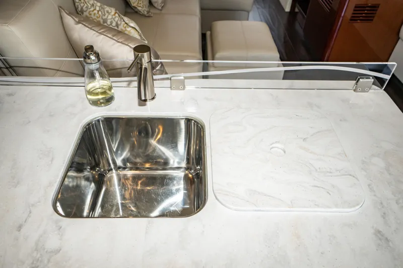 Yacht Photos Pics Modern kitchen sink area on 2017 Sea Ray Sundancer 460 yacht with marble countertop.