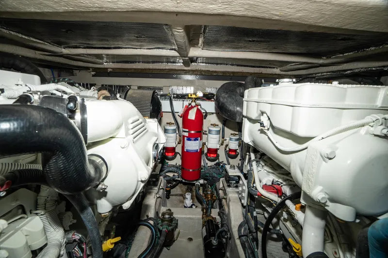  Yacht Photos Pics Engine room of 2017 Sea Ray Sundancer 460 with fire extinguisher and mechanical components.