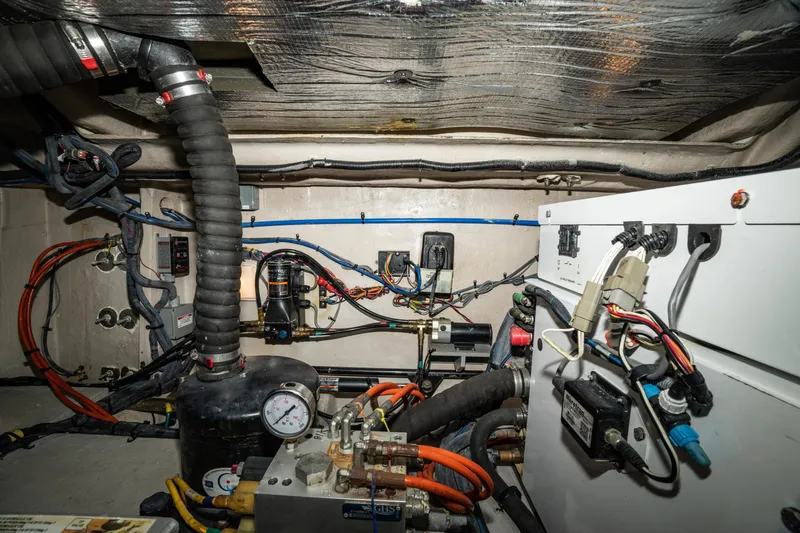  Yacht Photos Pics Engine room of 2017 Sea Ray Sundancer 460 with complex wiring and mechanical components.