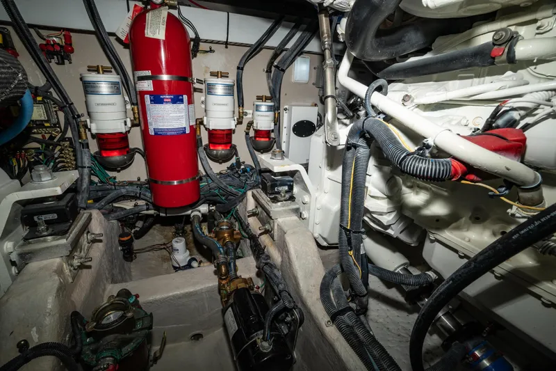  Yacht Photos Pics Engine room of 2017 Sea Ray Sundancer 460 with fire extinguisher and mechanical components.