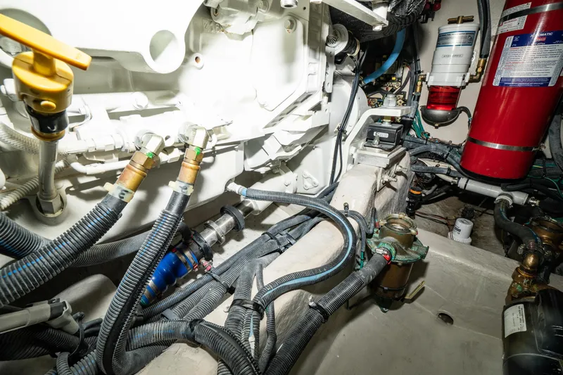  Yacht Photos Pics Engine room of 2017 Sea Ray Sundancer 460 with visible hoses and components.