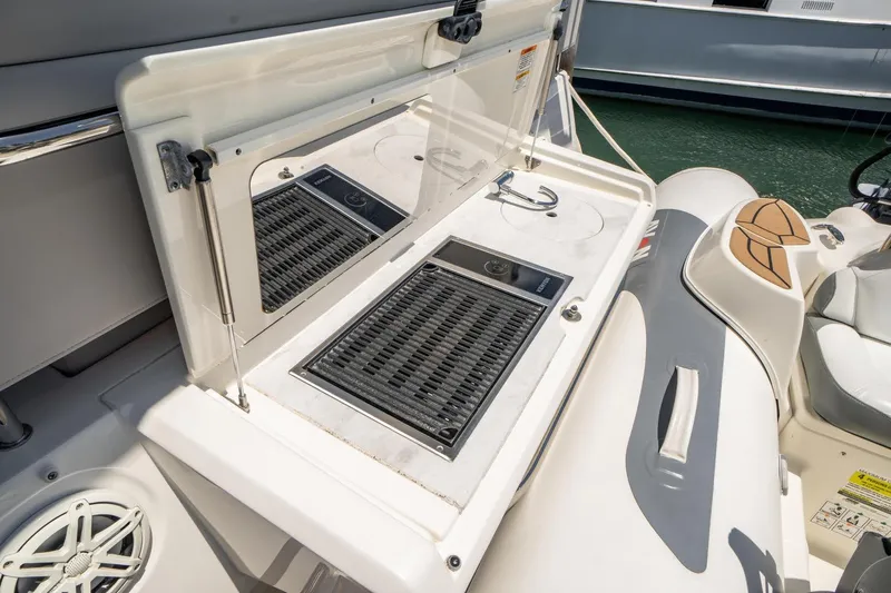  Yacht Photos Pics Outdoor kitchen area on 2017 Sea Ray Sundancer 460 yacht, featuring a grill and sink.