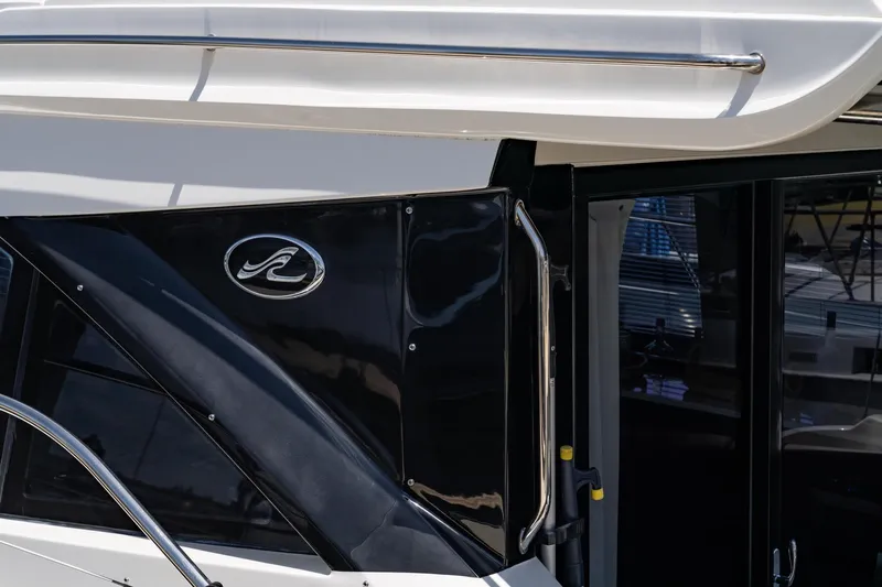  Yacht Photos Pics Close-up of 2017 Sea Ray Sundancer 460 yacht exterior with logo and sleek design.