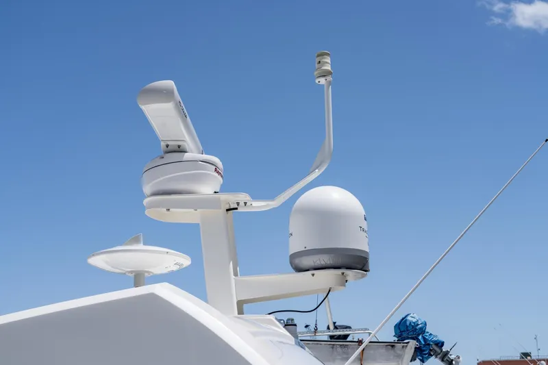  Yacht Photos Pics Radar and satellite equipment on a 2017 Sea Ray Sundancer 460 against a clear blue sky.