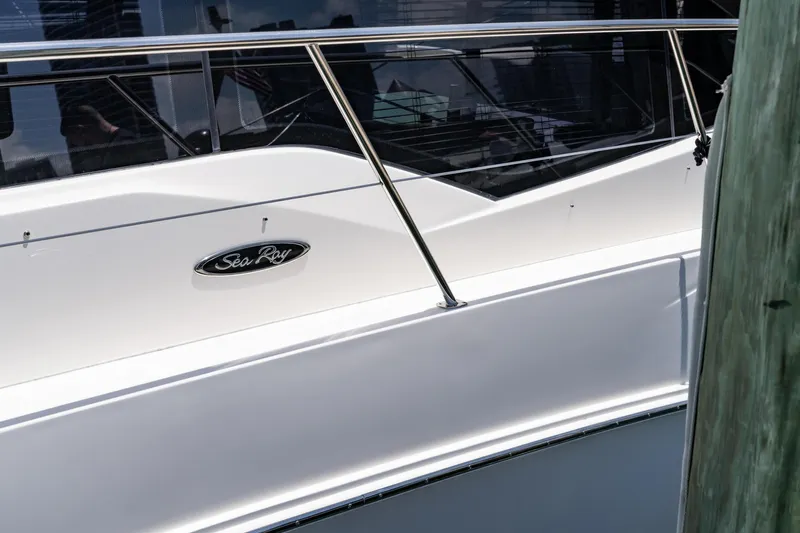  Yacht Photos Pics 2017 Sea Ray Sundancer 460 yacht, sleek white exterior with railing and logo.