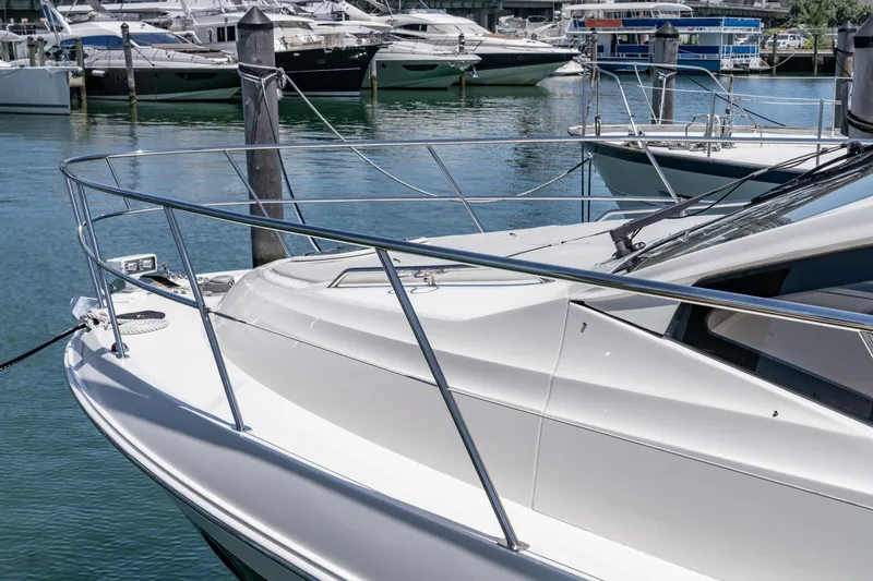  Yacht Photos Pics 2017 Sea Ray Sundancer 460 yacht docked in a marina, surrounded by other boats.