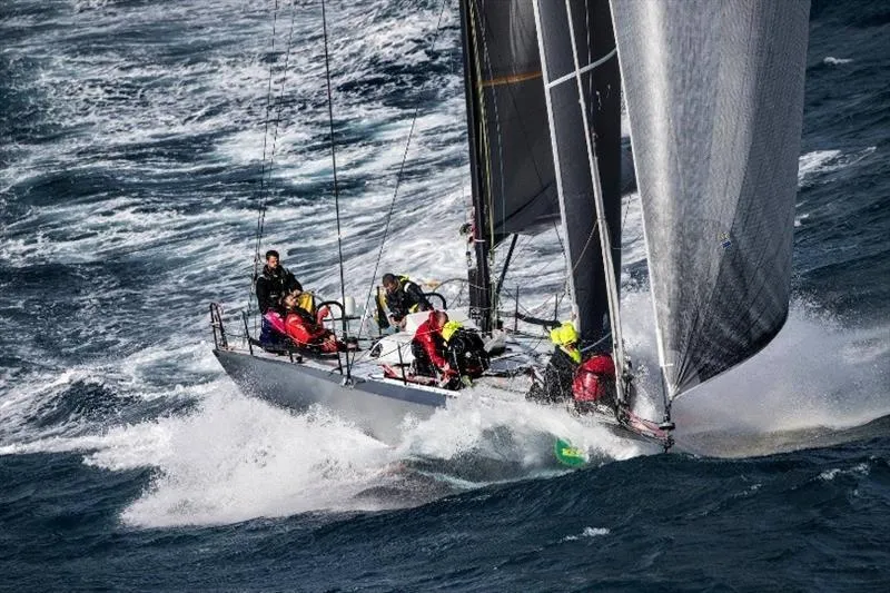 Maverick Yacht Photos Pics Sailboat racing through rough seas, crew in action, Infiniti 46, 2015 model.
