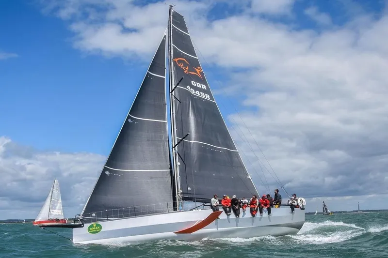 Maverick Yacht Photos Pics Sailing yacht Infiniti 46 from 2015 racing on open water under cloudy skies.