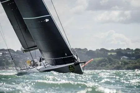 Maverick Yacht Photos Pics Sailing yacht Infiniti 46, 2015 model, navigating choppy waters under cloudy skies.