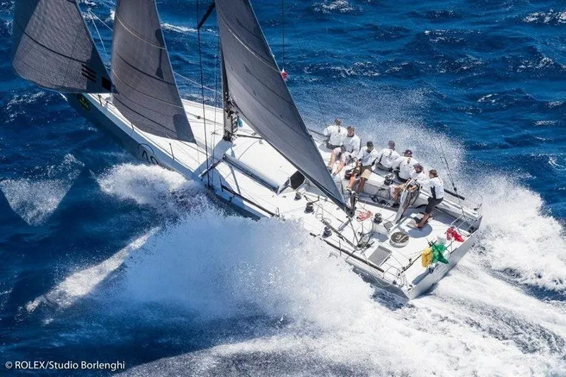 Maverick Yacht Photos Pics Sailing yacht Infiniti 46 navigating rough seas, crew in action, 2015.