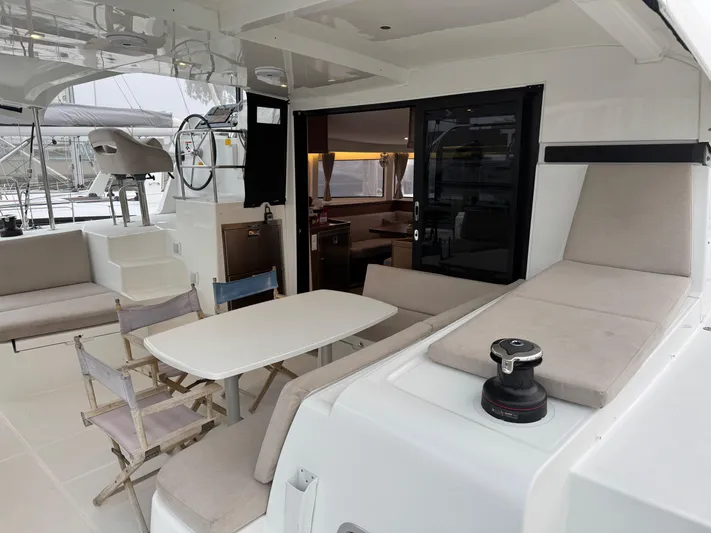 Catalina Breeze Yacht Photos Pics 2022 Lagoon 42 yacht with spacious deck, seating, and dining area.