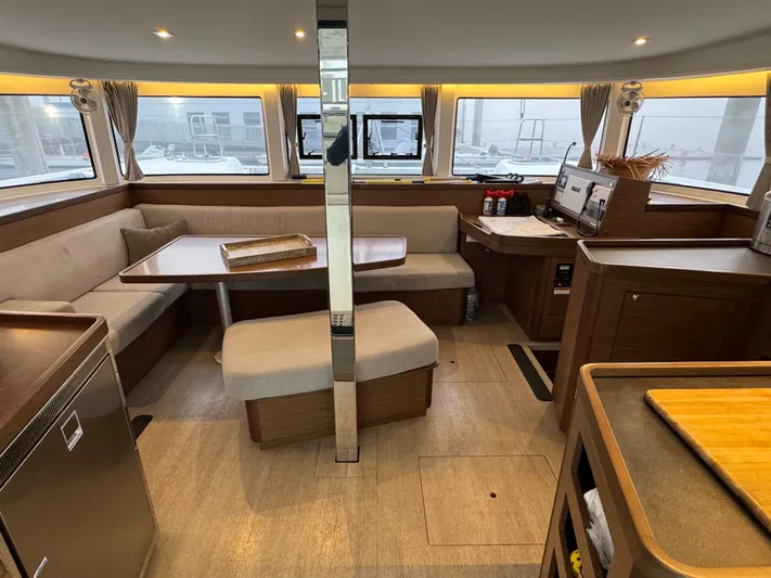 Catalina Breeze Yacht Photos Pics Interior of 2022 Lagoon 42 catamaran with modern seating and kitchen area.