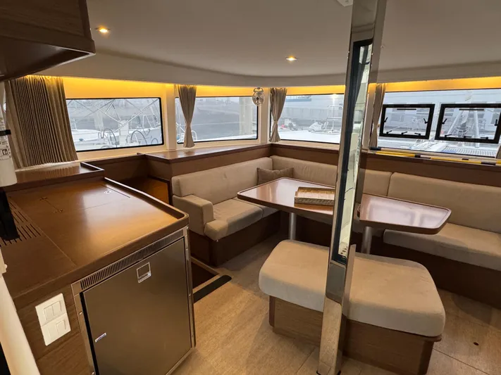 Catalina Breeze Yacht Photos Pics Luxurious interior of 2022 Lagoon 42 catamaran with modern seating and dining area.