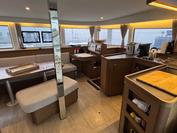 Catalina Breeze Yacht Photos Pics Interior of 2022 Lagoon 42 catamaran with modern kitchen and dining area.