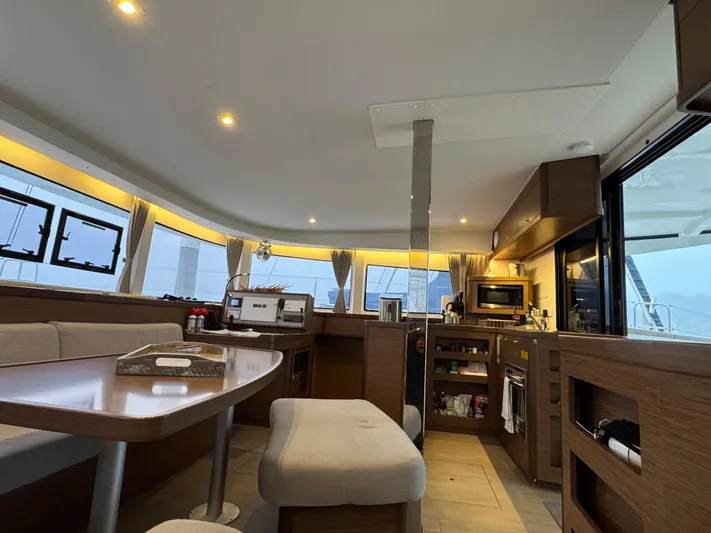 Catalina Breeze Yacht Photos Pics Interior of 2022 Lagoon 42 catamaran, featuring modern kitchen and dining area with ample natural light.