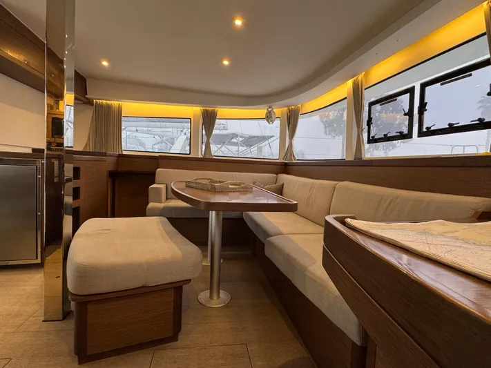 Catalina Breeze Yacht Photos Pics Luxurious interior of a 2022 Lagoon 42 catamaran with elegant seating and modern design.