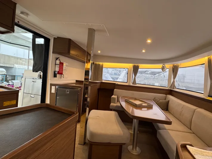 Catalina Breeze Yacht Photos Pics Interior of 2022 Lagoon 42 catamaran with modern seating and dining area.