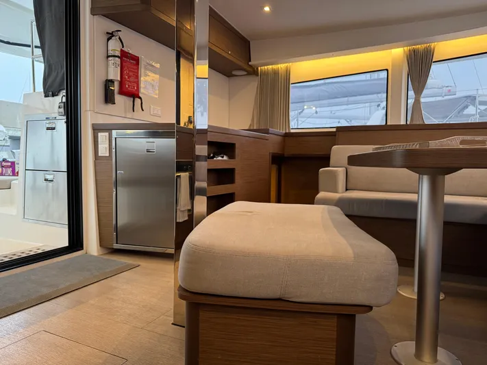 Catalina Breeze Yacht Photos Pics Interior of 2022 Lagoon 42 catamaran, featuring modern seating and kitchen area.